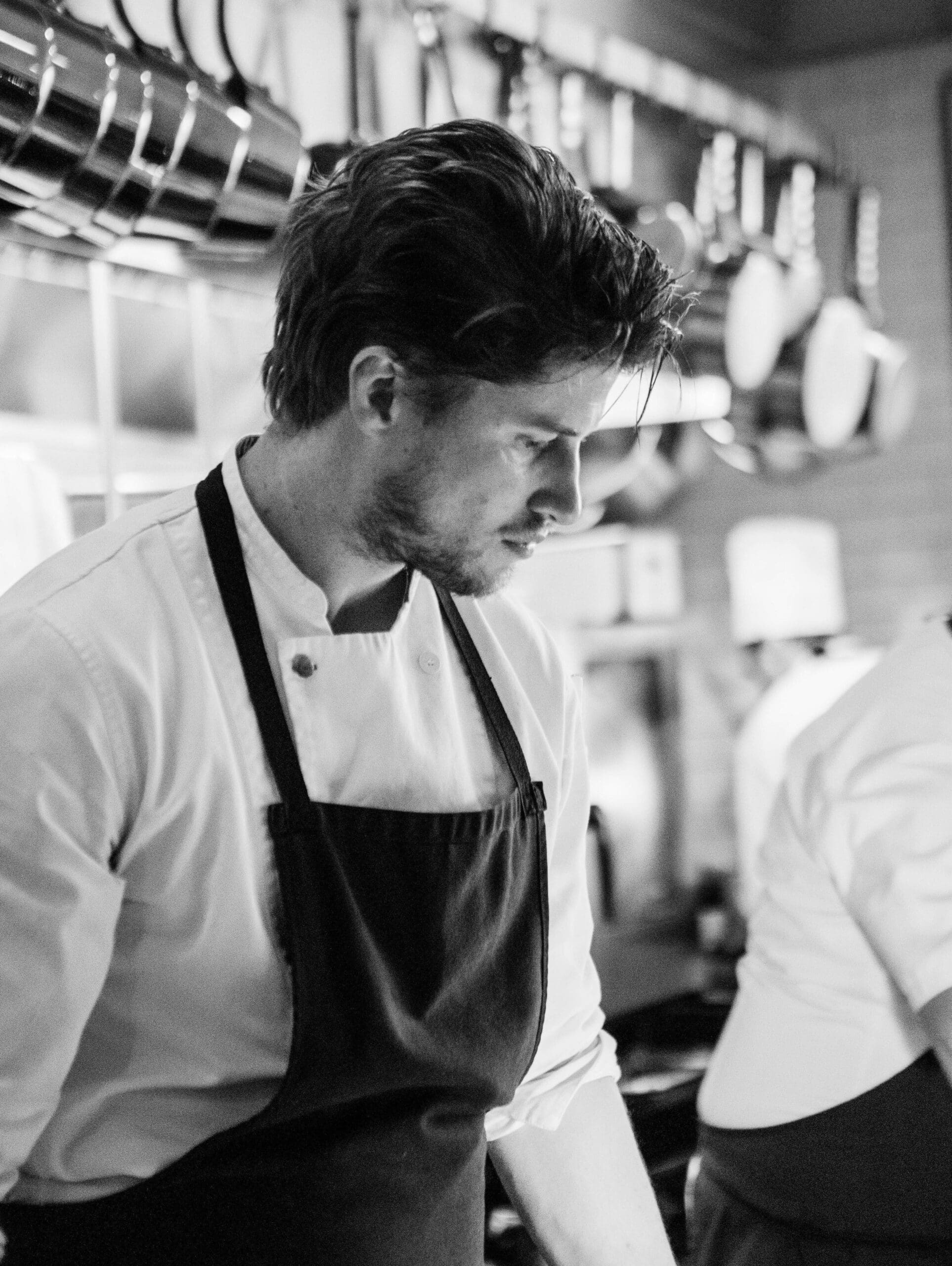 Image of Chef Alex working in a fine dining restaurant kitchen